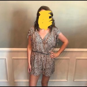 Large but fits like a medium leopard print romper